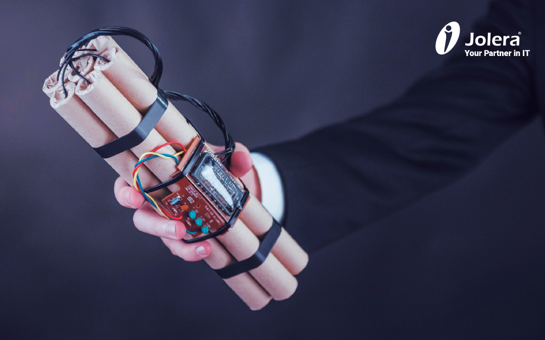 Man holding a ticking bomb representing a security threat