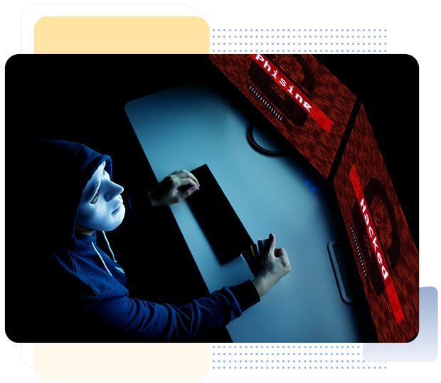 hacker in mask under hood hacking and phishing