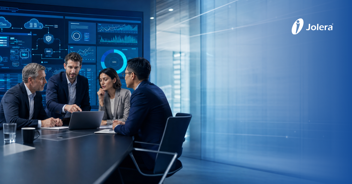 Business executives in a boardroom reviewing a proposal document from an IT service provider.