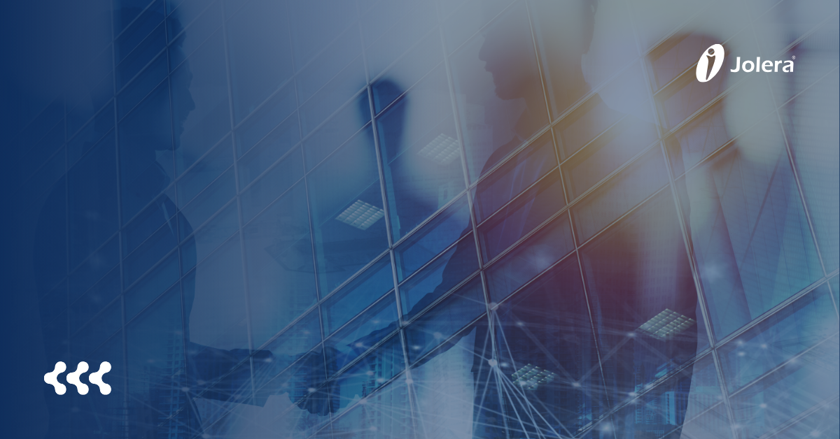 Two technology teams collaborating around a digital workspace, representing a strategic IT partnership built for growth.